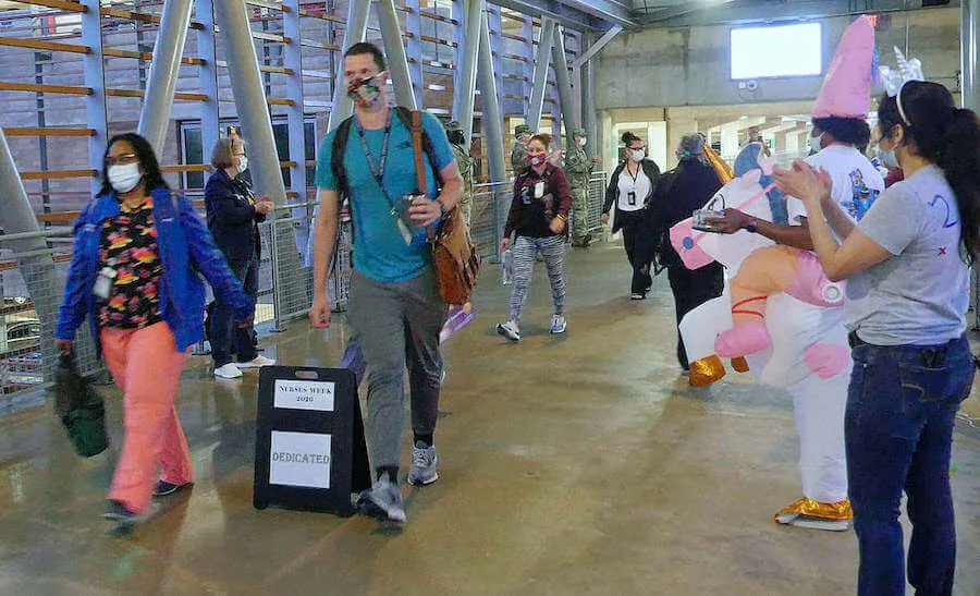 crowd of nurses entering area to applause and celebration nurses week 2020 what is nurses week and when is nurses week 2020 nurses week