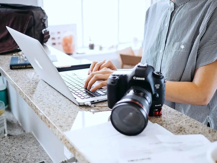 woman looking on computer finishing travel nurse paperwork staff nurse to travel nurse