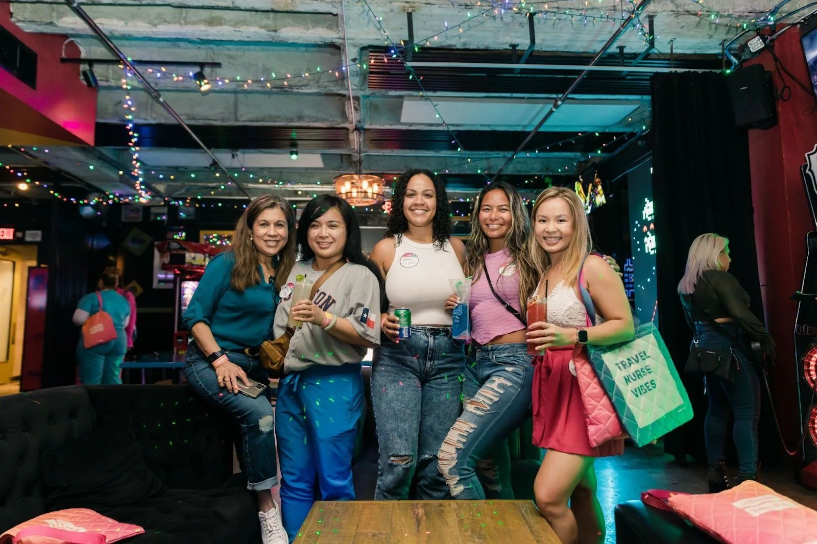 A lively photo capturing five clinicians enjoying their time, drinks in hand, and sharing laughs at a fun-filled Trusted event, representing the camaraderie and joy within the Trusted Circle.