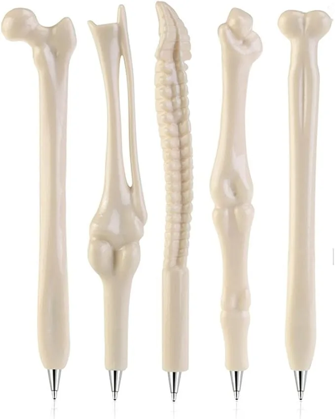 A set of five bone-shaped ballpoint pens, each resembling different bones such as a femur, tibia, and spine, in an off-white color that mimics the look of real bones. These novelty pens are a quirky and functional addition to any physical therapist's toolkit.